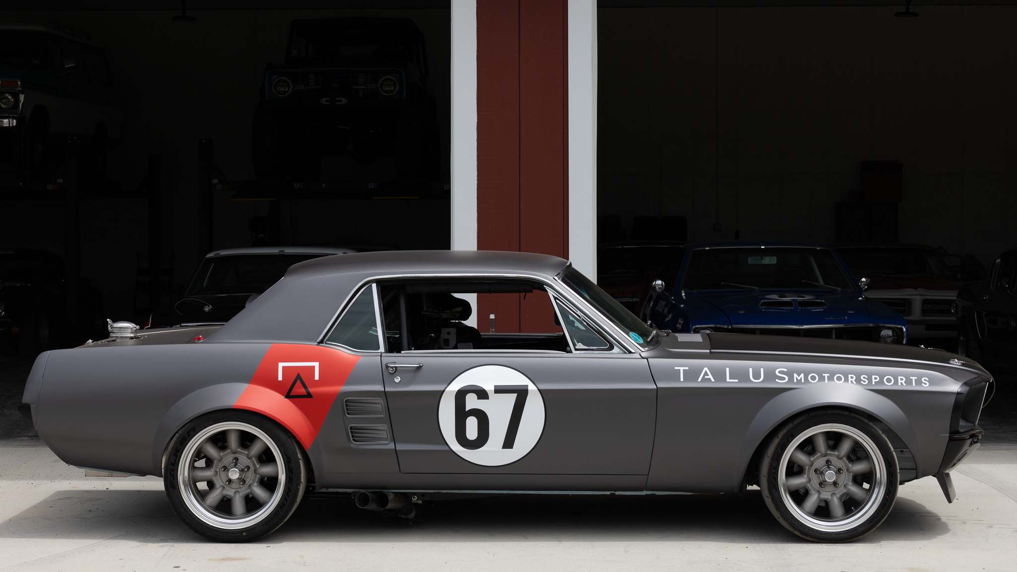 1967 Mustang Coupe side profile outside the workshop